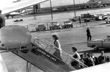 Mrs. Kennedy Boards Air Force One - Alone