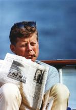 JFK Reading and Smoking Cigar