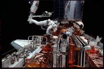 Astronaut Michael Massimino Working on Hubble 