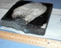 White Silica Base Material on Damaged Heat Tile
