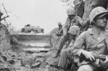 Troops Using Bulldozers to Clear the Way to the Inland